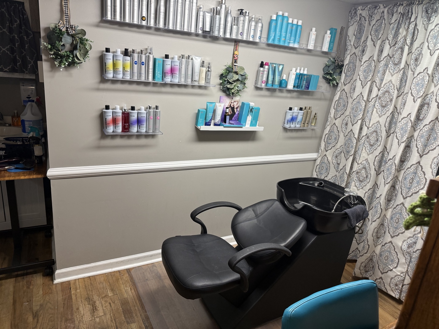 Amy's shampoo area and professional hair care product display
