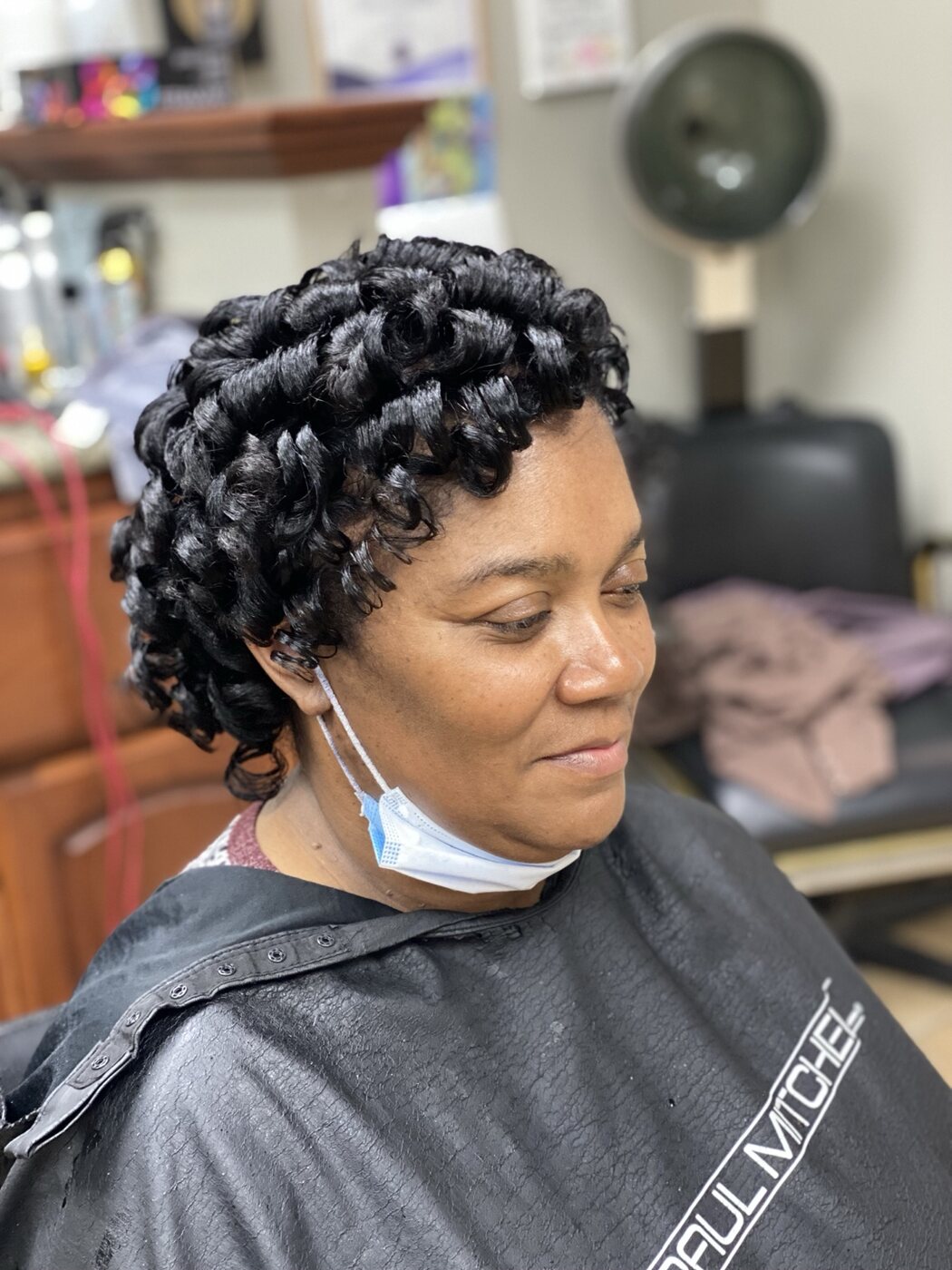 Glossy black curl set with a softly shaped side finish