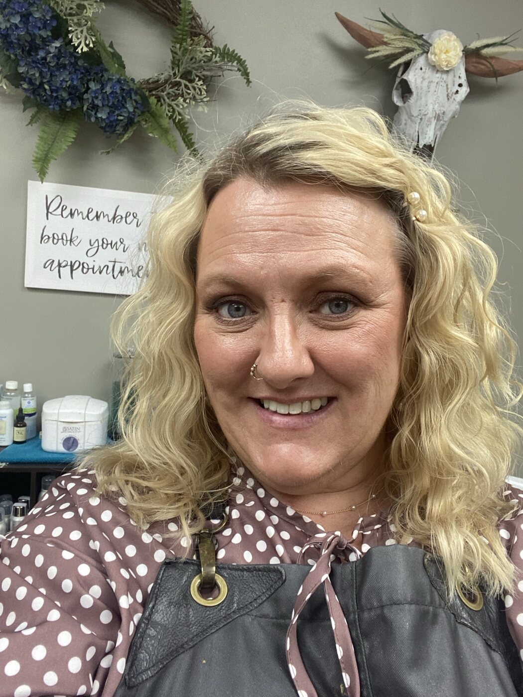 Long blonde hair styled in natural-looking curls