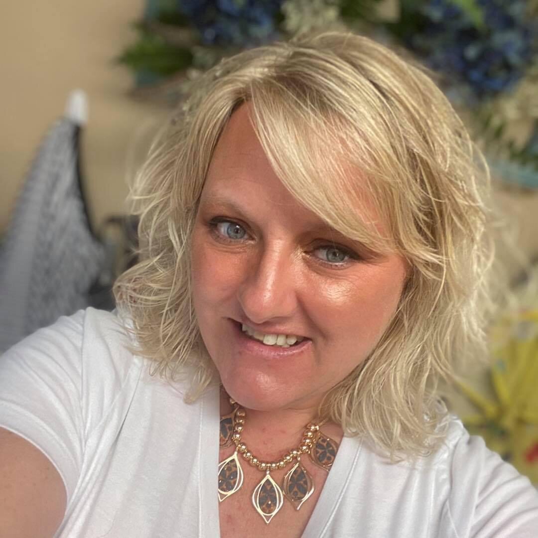 Blonde layered cut with soft face-framing texture
