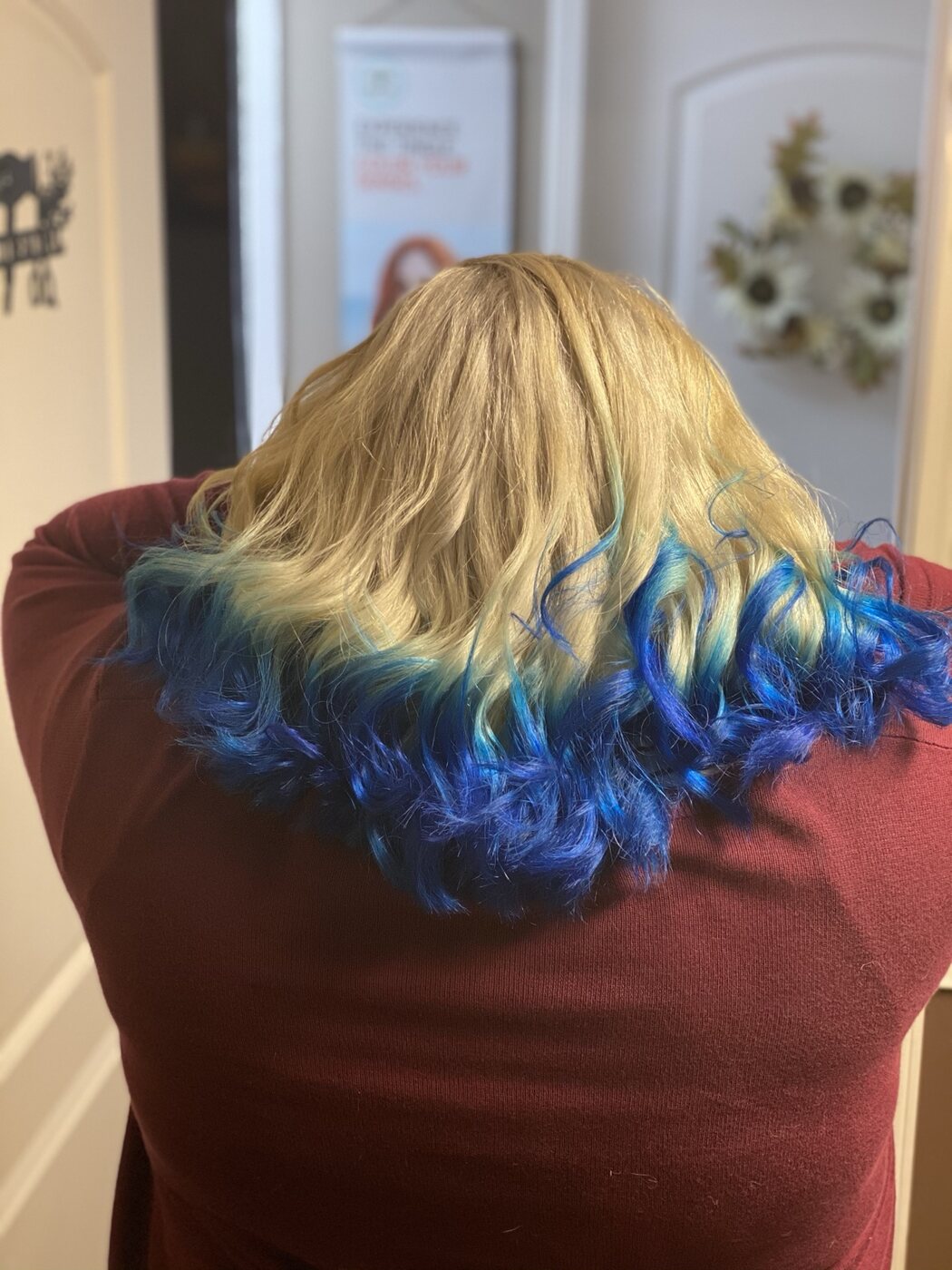 Blonde waves finished with vivid blue color