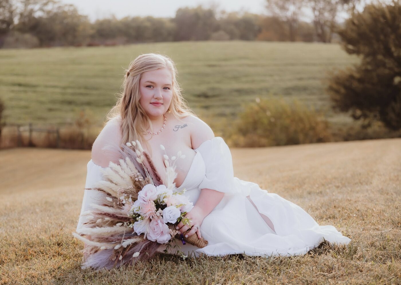 Bride with long blonde hair styled in soft romantic waves