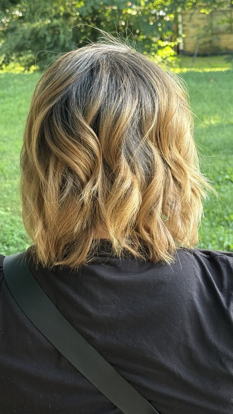 Dimensional bronde long bob viewed from the back