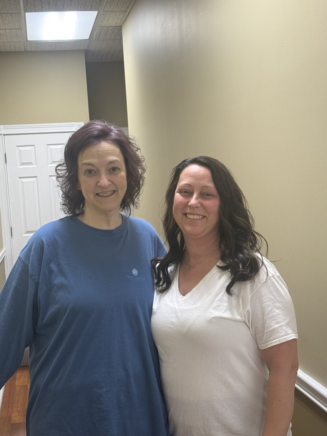 Clients showing softly curled brunette hairstyles