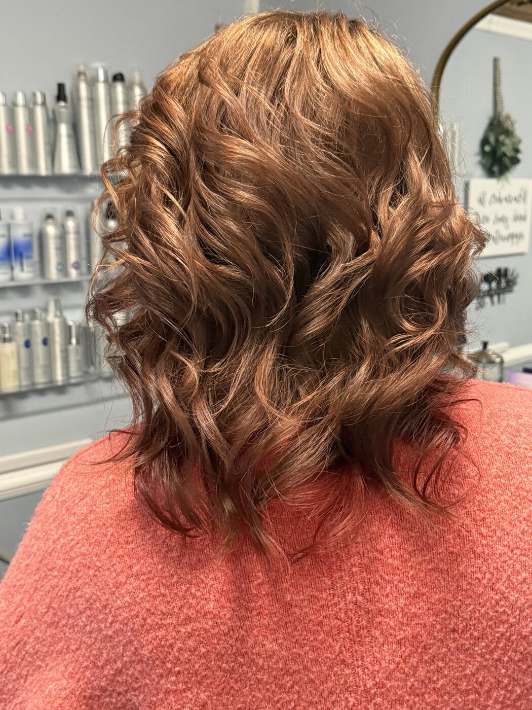 Copper color finished in glossy defined curls