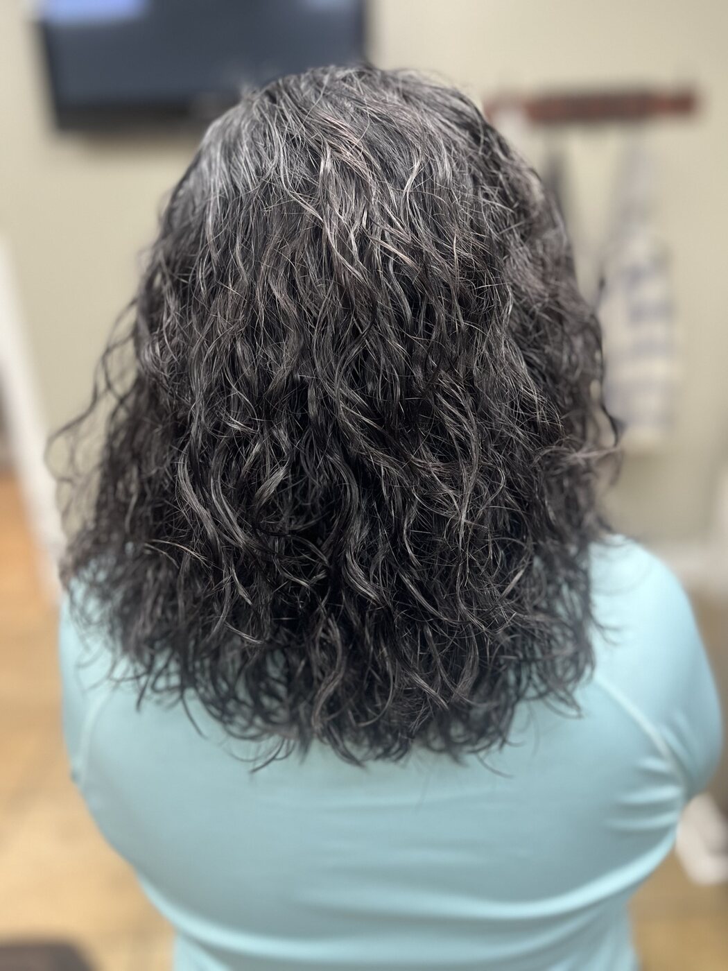 Dark hair finished with defined natural-looking curls