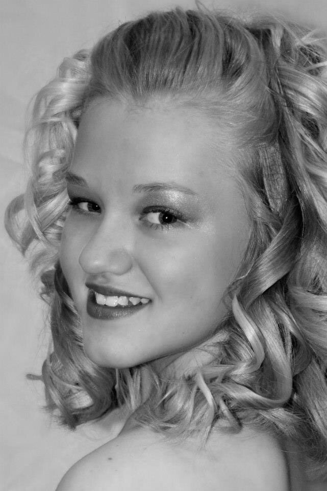 Blonde hair finished in soft glamorous curls