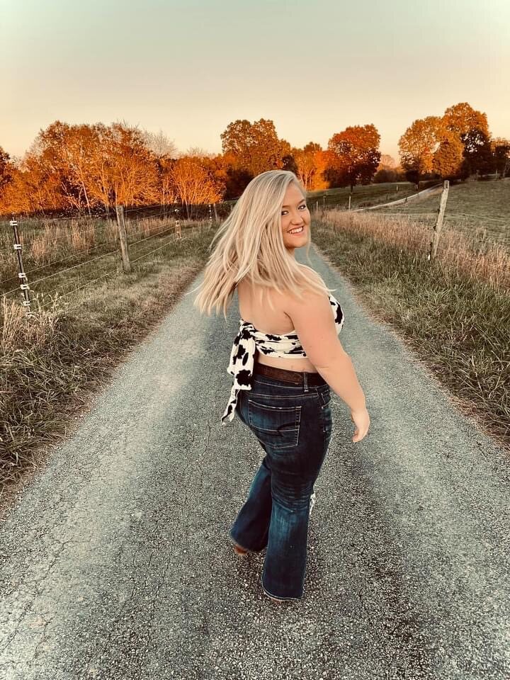 Long bright blonde hair styled for an outdoor portrait