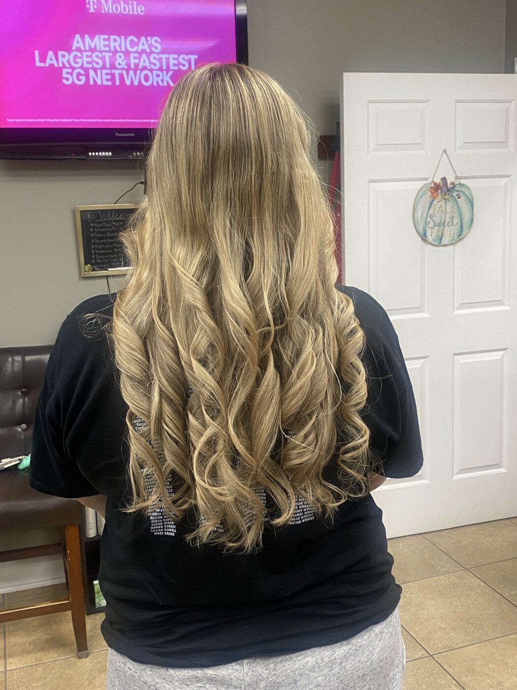 Long golden blonde hair styled in flowing curls