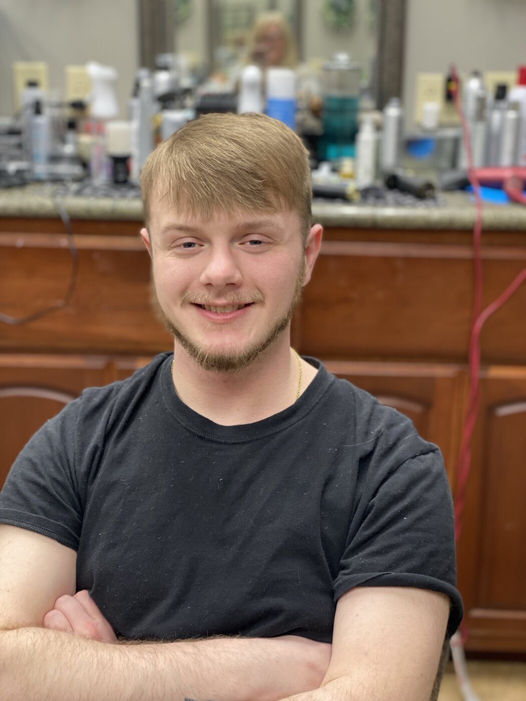 Classic men's haircut with a neat natural finish