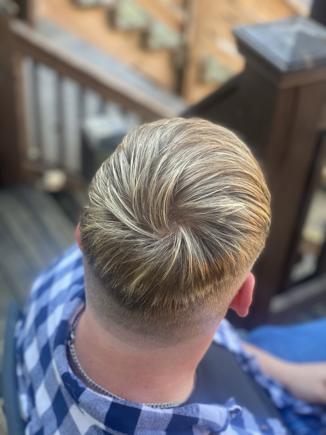 Men's haircut with a smooth tapered back