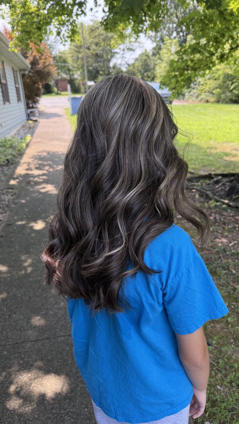 Long rich brunette hair with a smooth glossy finish