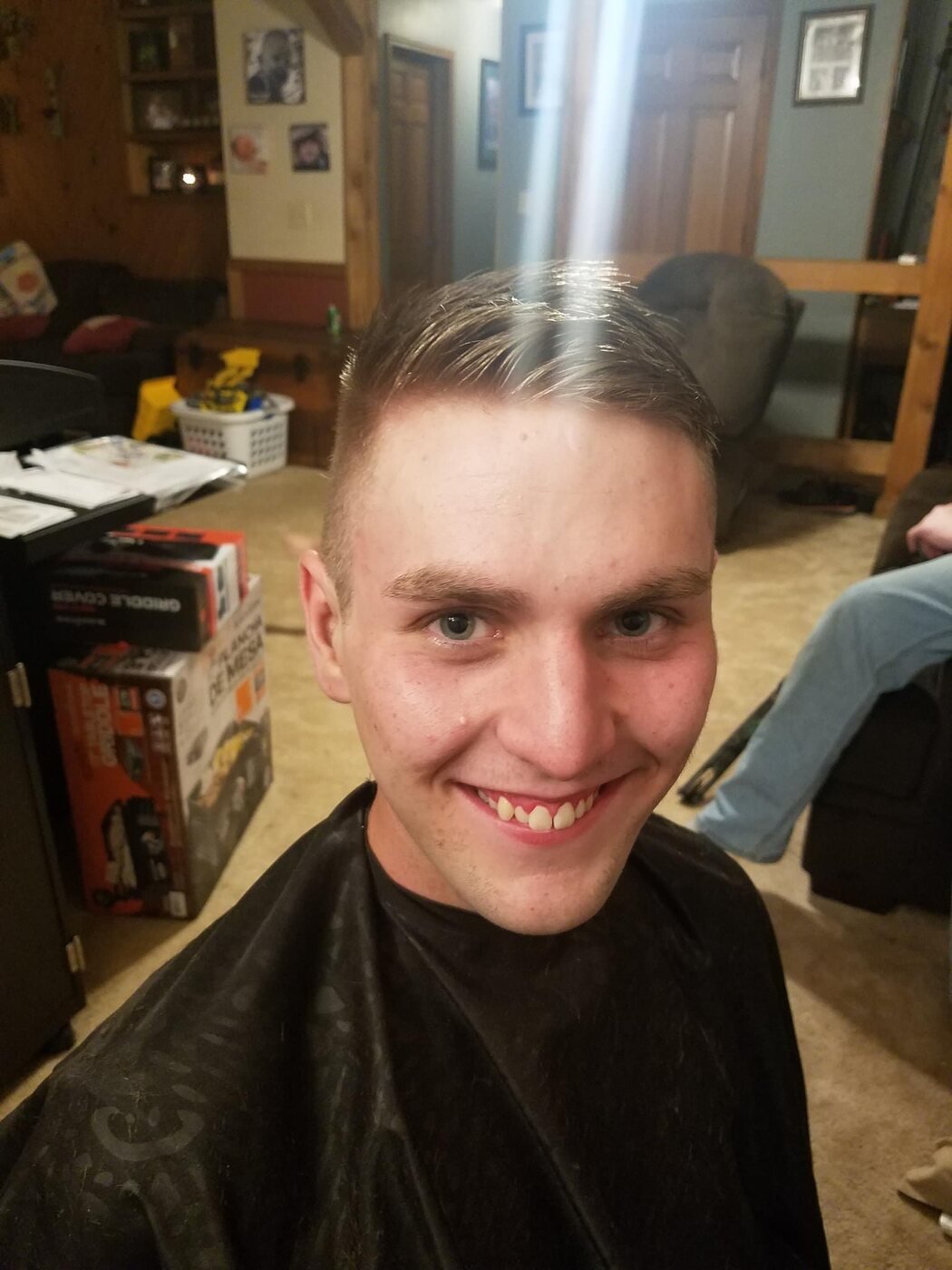 Short men's haircut with a clean tapered finish