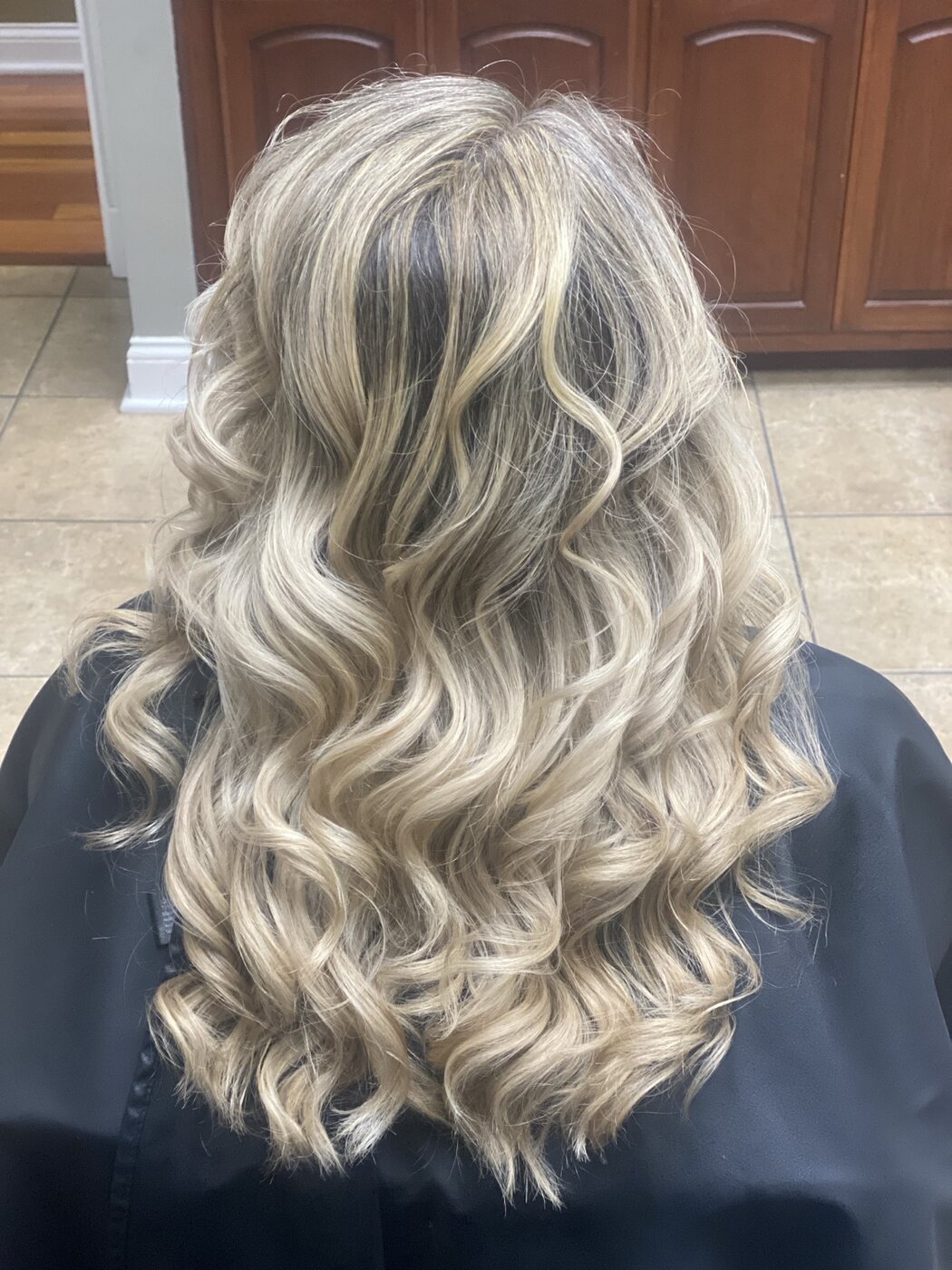 Silver and blonde highlights finished in flowing curls