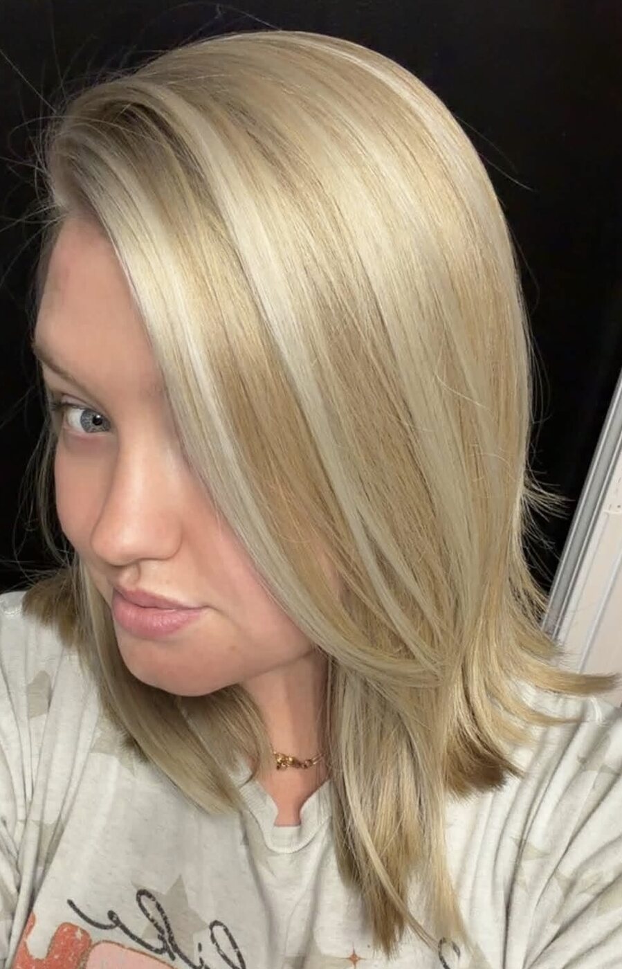 Smooth blonde long bob with soft face-framing layers