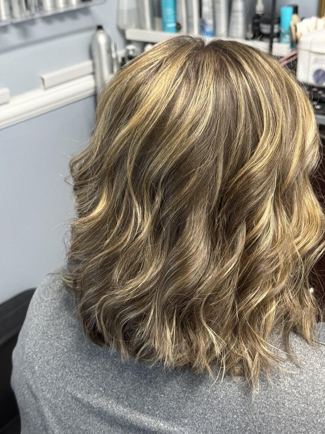 Highlighted long bob styled in tousled waves